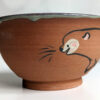 cute otter bowl for matcha in red clay and blue glaze