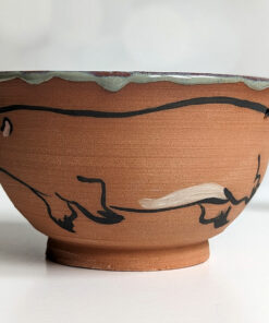 cute otter bowl for matcha in red clay and blue glaze