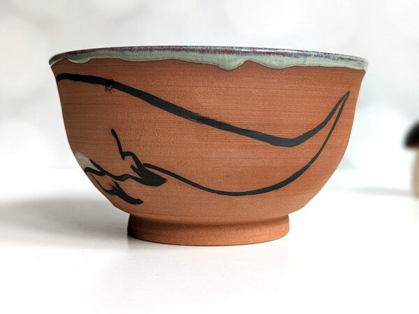 cute otter bowl for matcha in red clay and blue glaze