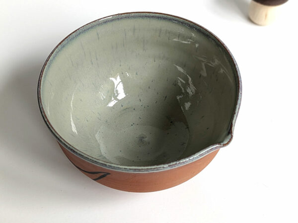 cute otter bowl for matcha in red clay and blue glaze