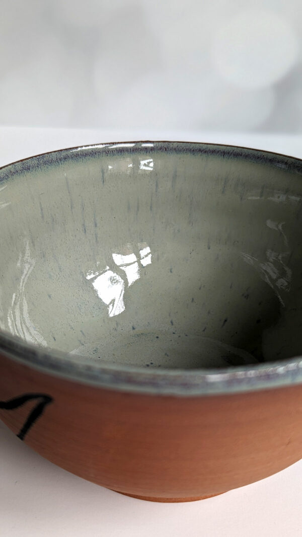 cute otter bowl for matcha in red clay and blue glaze