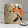 cute cup in speckled clay illustrated with fox and hare - kness