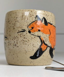 cute cup in speckled clay illustrated with fox and hare - kness