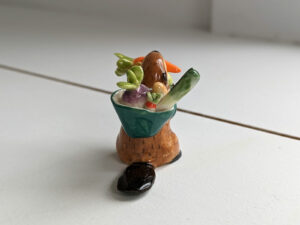 cute beaver holding vegetables figurine porcelain kness