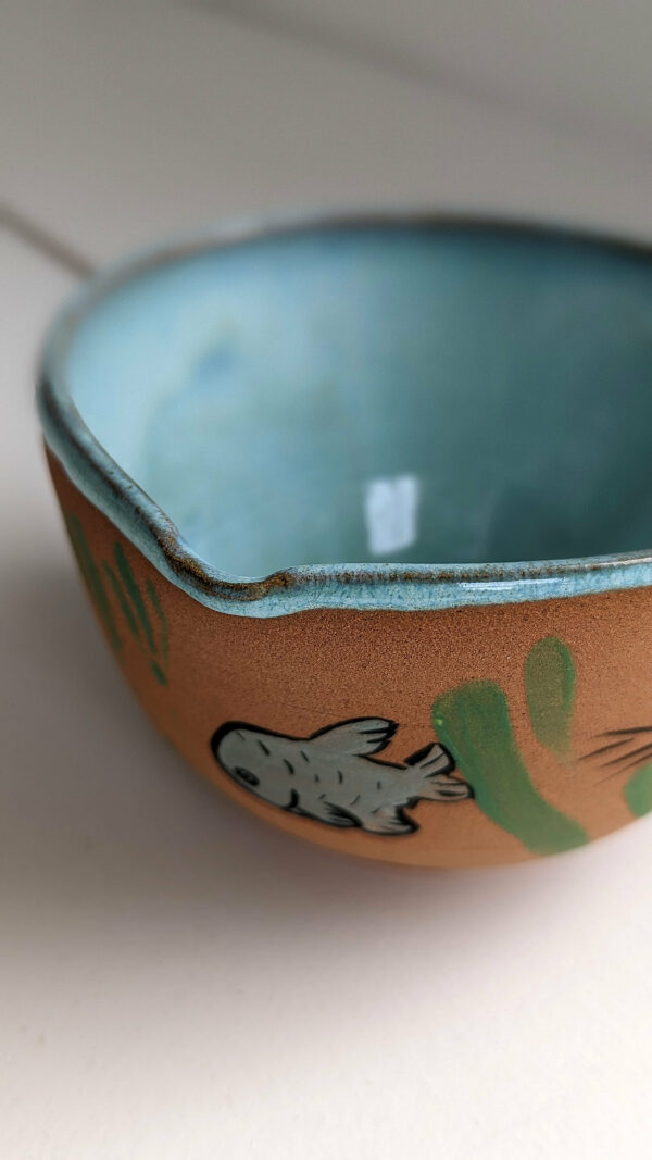 cute otter bowl for matcha in red clay and blue glaze