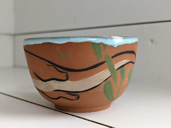 cute otter bowl for matcha in red clay and blue glaze