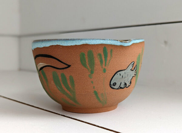 cute otter bowl for matcha in red clay and blue glaze