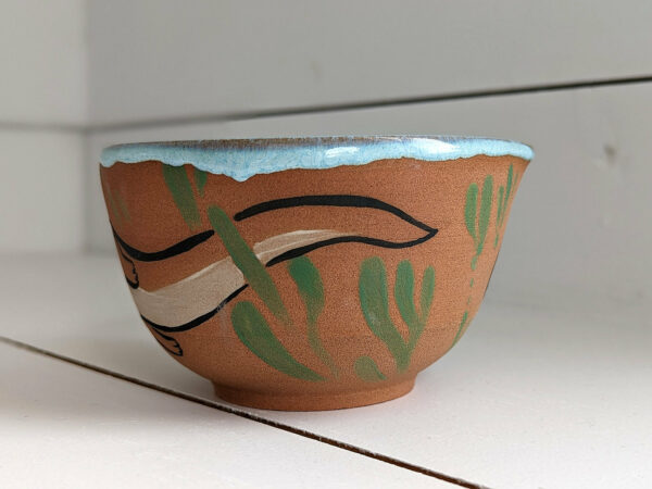 cute otter bowl for matcha in red clay and blue glaze
