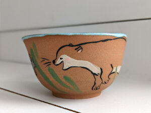 cute otter bowl for matcha in red clay and blue glaze