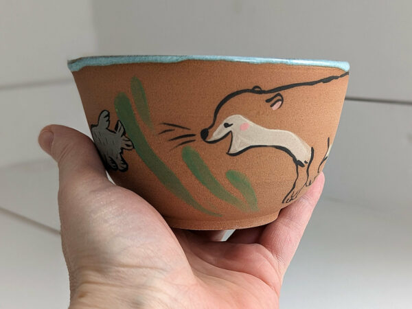 cute otter bowl for matcha in red clay and blue glaze