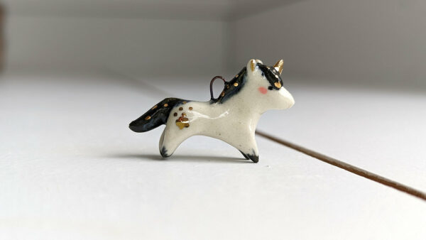 adorable porcelain pendant unicorn with night colored mane and tail, gold, handmade, one of a kind by kness