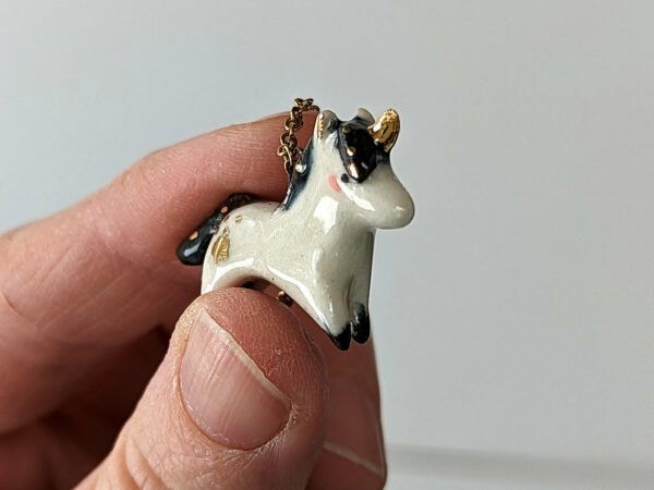 adorable porcelain pendant unicorn with night colored mane and tail, gold, handmade, one of a kind by kness