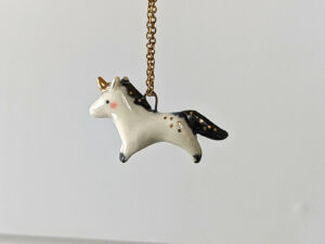 adorable porcelain pendant unicorn with night colored mane and tail, gold, handmade, one of a kind by kness