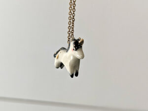 adorable porcelain pendant unicorn with night colored mane and tail, gold, handmade, one of a kind by kness