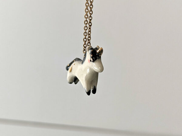 adorable porcelain pendant unicorn with night colored mane and tail, gold, handmade, one of a kind by kness