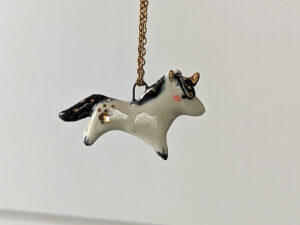 adorable porcelain pendant unicorn with night colored mane and tail, gold, handmade, one of a kind by kness