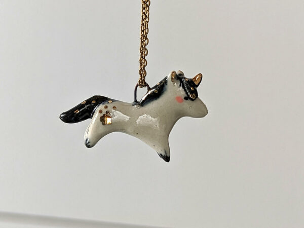 adorable porcelain pendant unicorn with night colored mane and tail, gold, handmade, one of a kind by kness