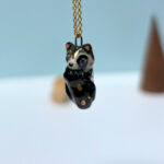 cute raccoon pendant sleepy