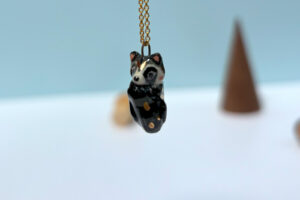 cute raccoon pendant sleepy