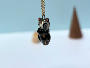 cute raccoon pendant sleepy