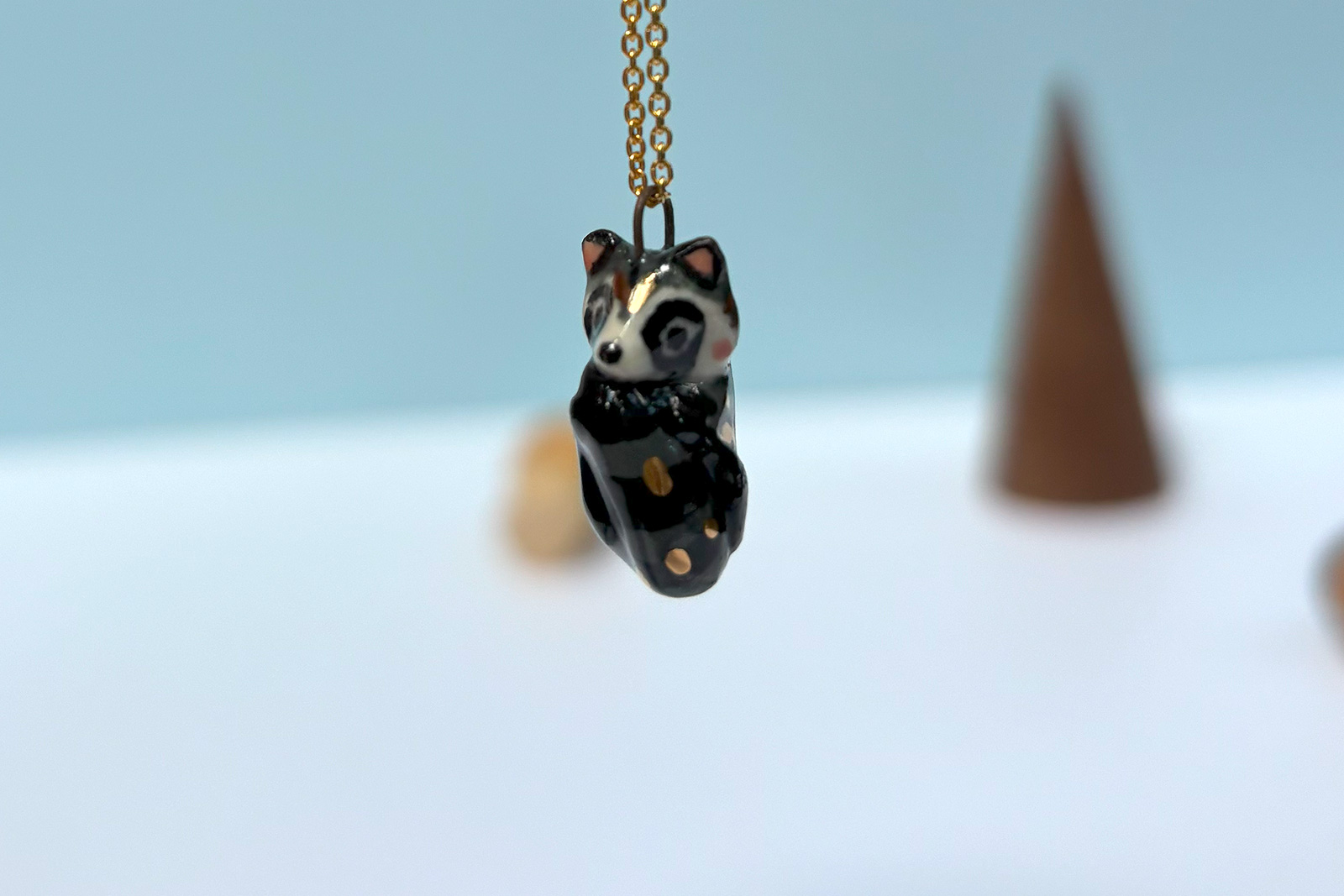 cute raccoon pendant sleepy