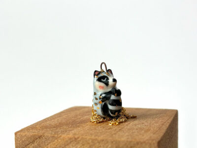 cute raccoon pendant sleepy
