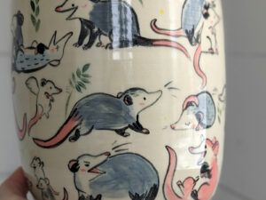 big planter with 32 cute opossums, hand painted and one of a kind,