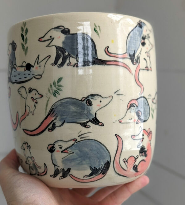 big planter with 32 cute opossums, hand painted and one of a kind,