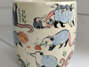 big planter with 32 cute opossums, hand painted and one of a kind,