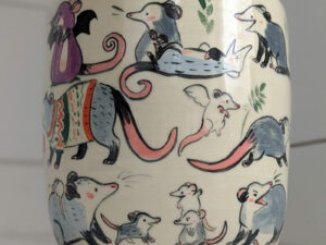 big planter with 32 cute opossums, hand painted and one of a kind,