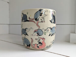 big planter with 32 cute opossums, hand painted and one of a kind,