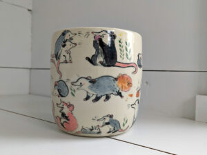 big planter with 32 cute opossums, hand painted and one of a kind,