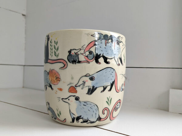 big planter with 32 cute opossums, hand painted and one of a kind,