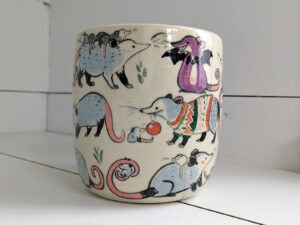 big planter with 32 cute opossums, hand painted and one of a kind,