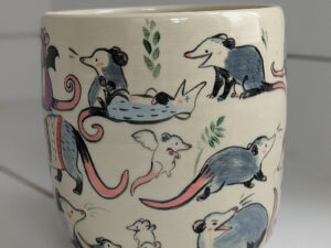 big planter with 32 cute opossums, hand painted and one of a kind,