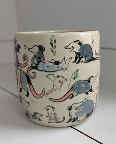 big planter with 32 cute opossums, hand painted and one of a kind,