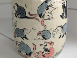 big planter with 32 cute opossums, hand painted and one of a kind,