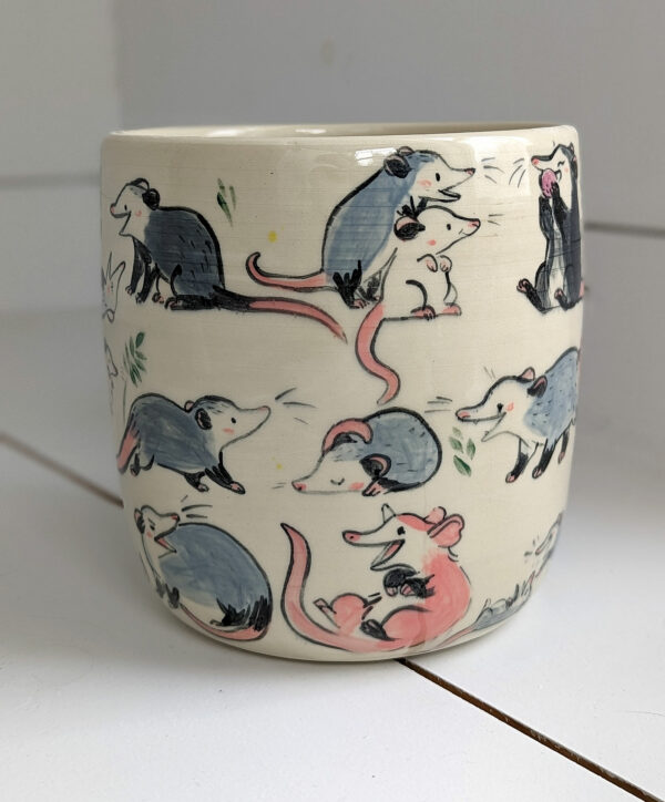 big planter with 32 cute opossums, hand painted and one of a kind,
