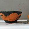 black stoneware handmade orange octopus bowl