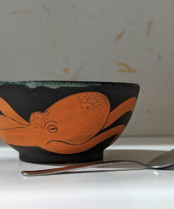 black stoneware handmade orange octopus bowl