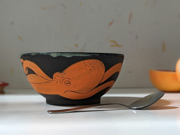 black stoneware handmade orange octopus bowl