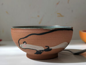 cute otter bowl red clay