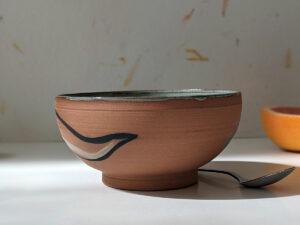 cute otter bowl red clay