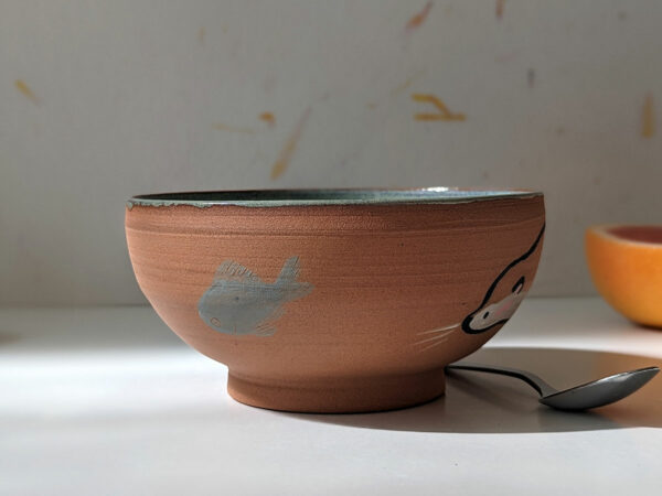 cute otter bowl red clay