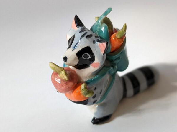 adorable raccoon figurine with a cute backpack porcelain