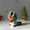 adorable raccoon figurine with a cute backpack porcelain