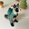 adorable raccoon figurine with a cute backpack porcelain