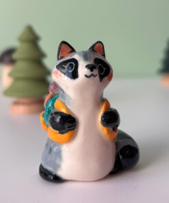 adorable raccoon figurine with a cute backpack porcelain