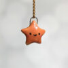 cut star pendant burnt orange