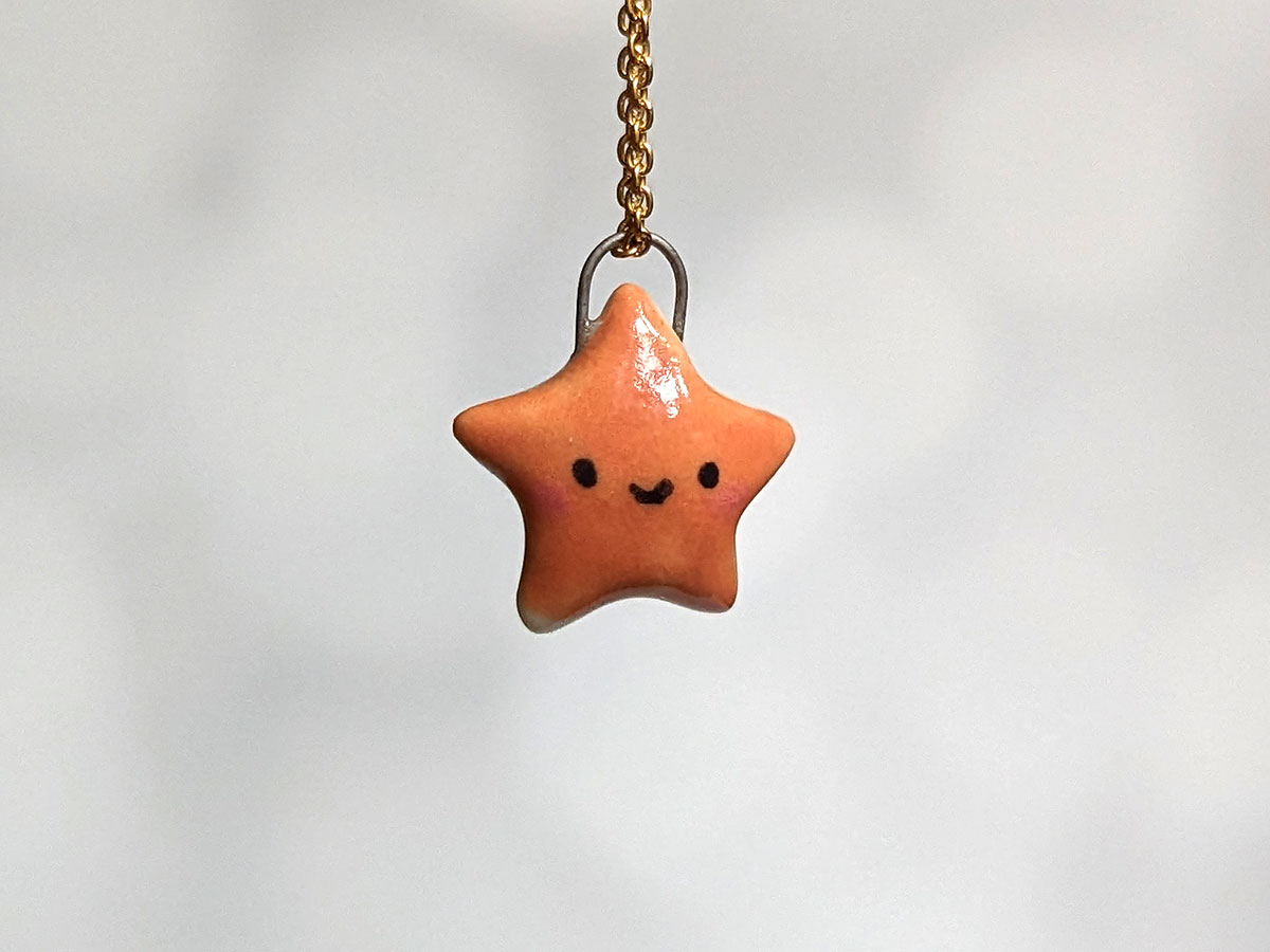 cut star pendant burnt orange